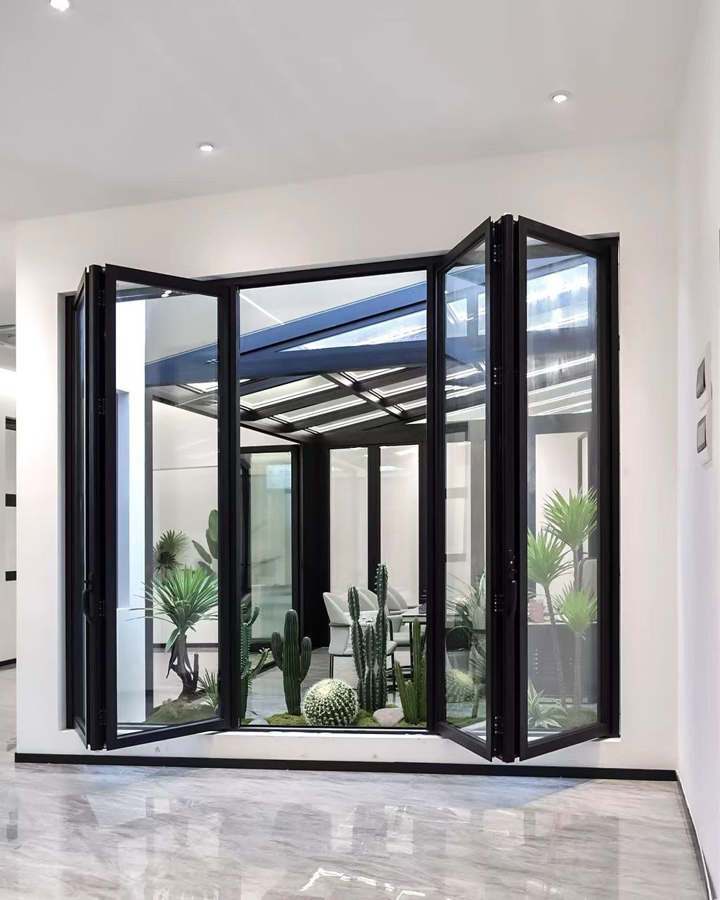 Black aluminum folding glass doors with panels folded open